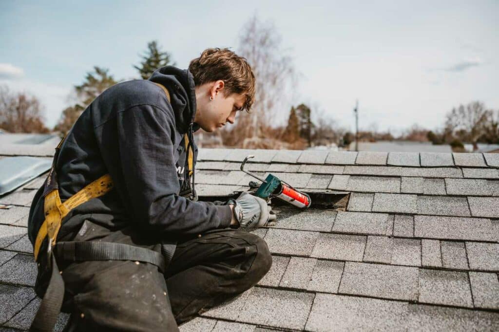 man doing roof restoration RoofMaxx of Tri-Cities