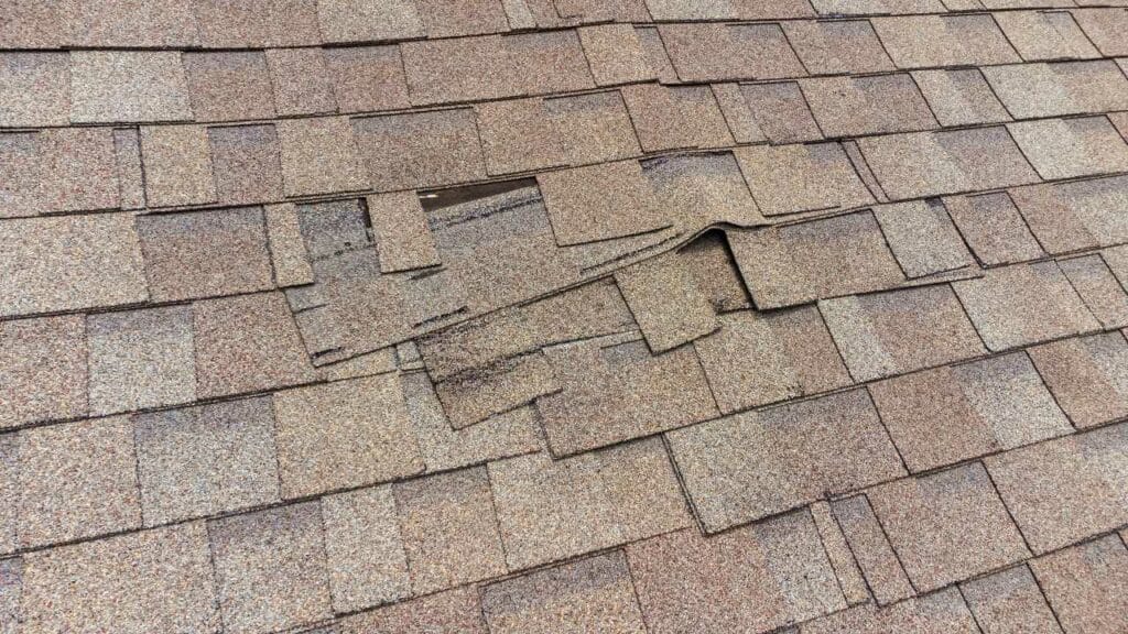 cracked roof - common signs of a wind damage roof Roofmaxx of Tri-Cities