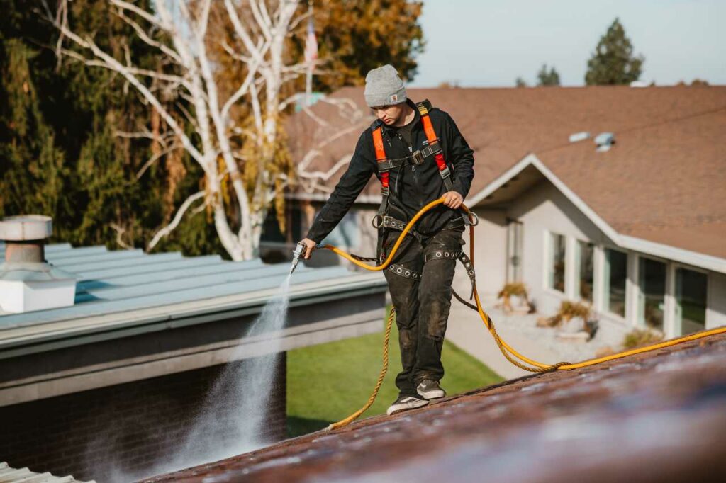 our skilled professional doing the RoofMaxx treatment Roofmaxx of Tri-Cities